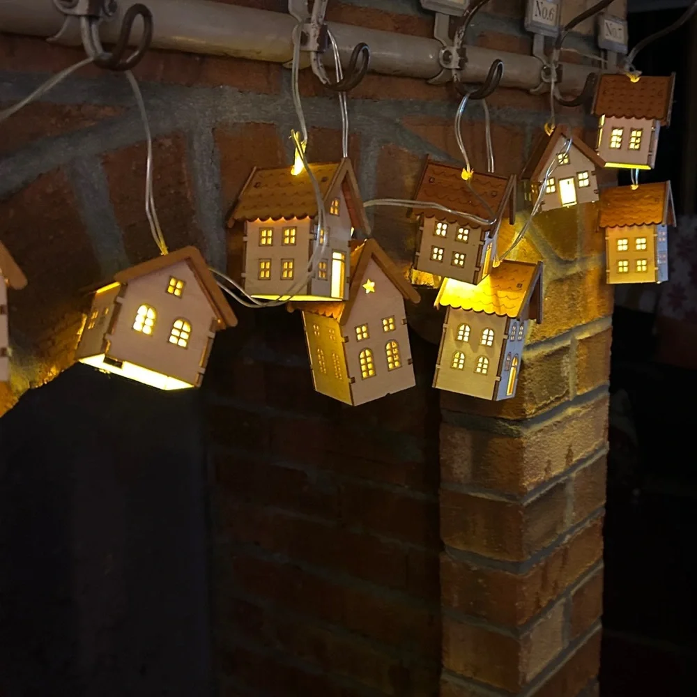 2 sets of tiny House garland with battery operated lights inside. 10 ft cord.